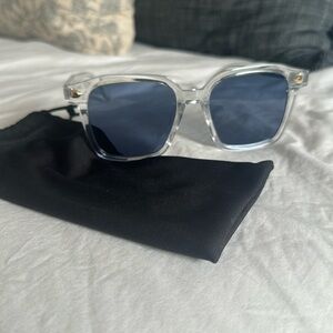 Clear frames, blue lens sunglasses from Iceland